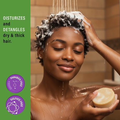 Woman washing her hair with Doyley's Haitian Castor Oil Shampoo Bar in a shower
